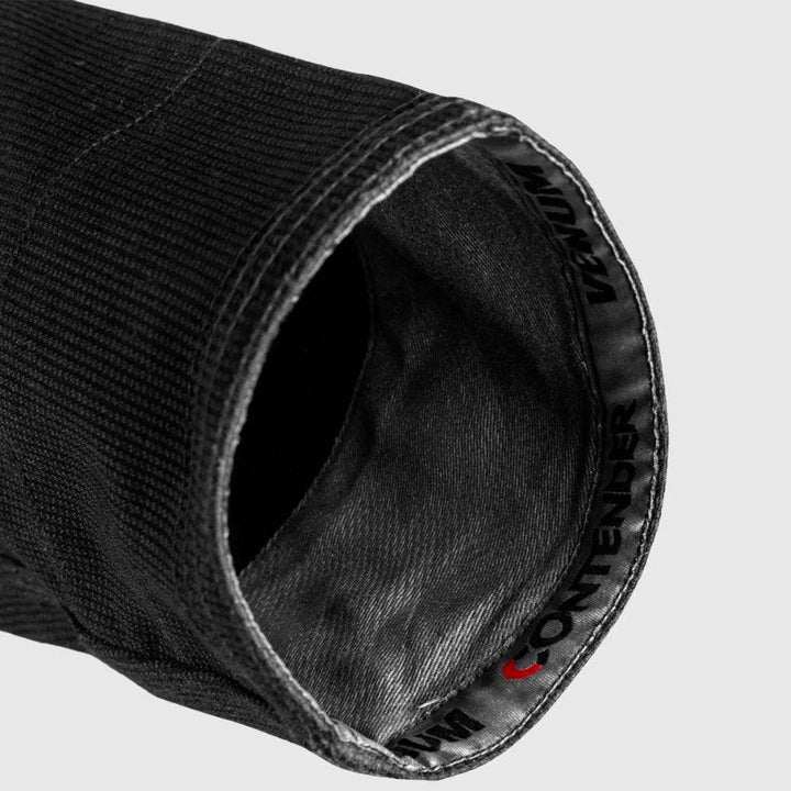 Interior view of the sleeve cuff with branded tape reading 'Venum Contender', showing reinforced stitching and finish.