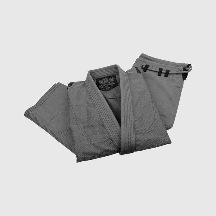 Folded jacket and pants of the grey Venum BJJ Gi set.