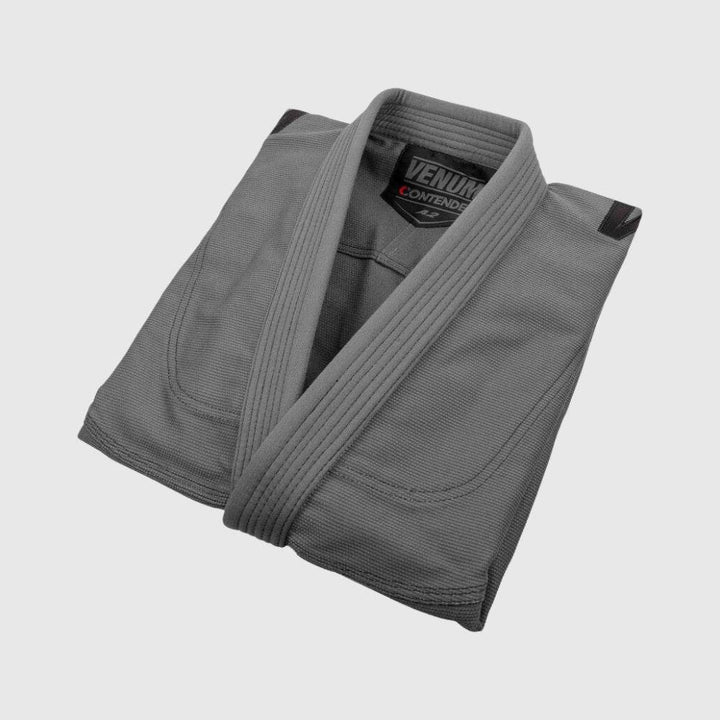 Neatly folded jacket showing stitching, collar, and inner logo.