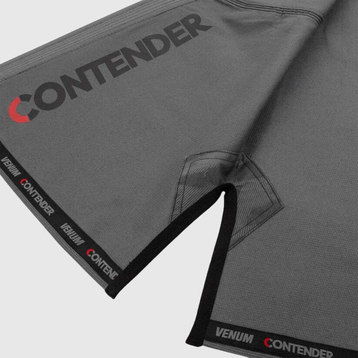Sleeve end close-up featuring Venum and Contender branding on inner lining.