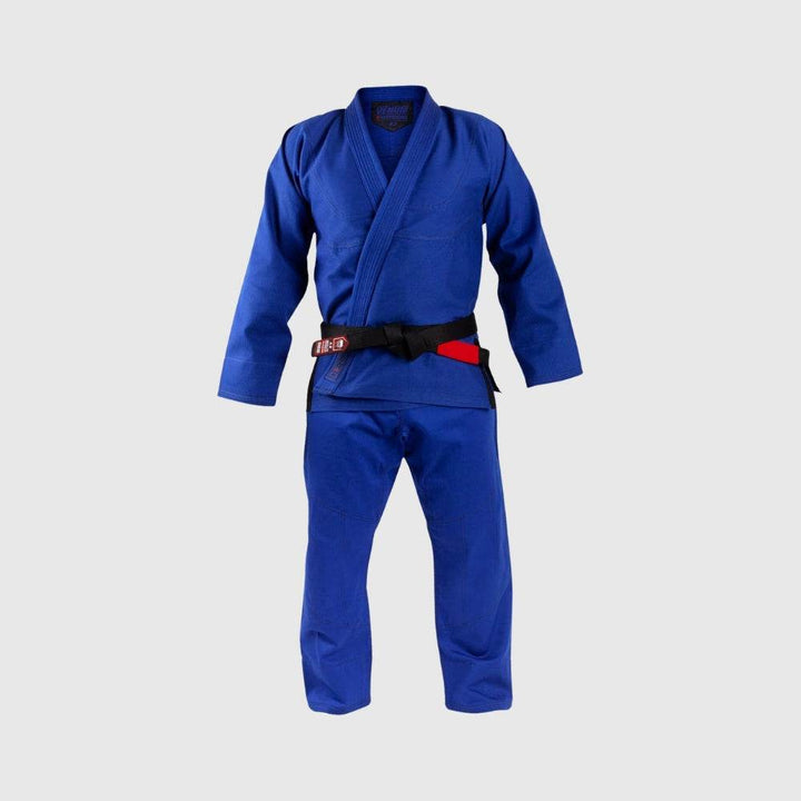 Full frontal view of the blue gi set worn on a mannequin, showcasing the structure and fit of the jacket and pants.