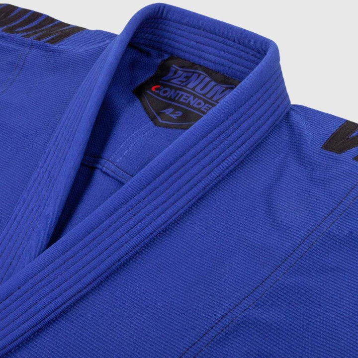 Close-up of the lapel showing VENUM CONTENDER A2 patch and prominent collar stitch detail.