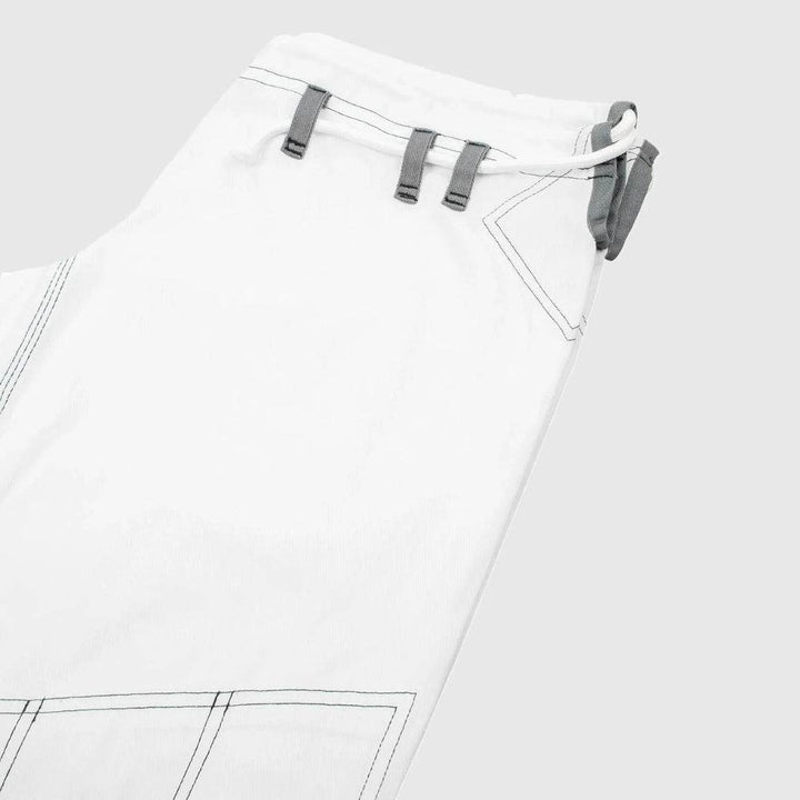 Tight shot of pants waistband and triple-loop drawstring area.