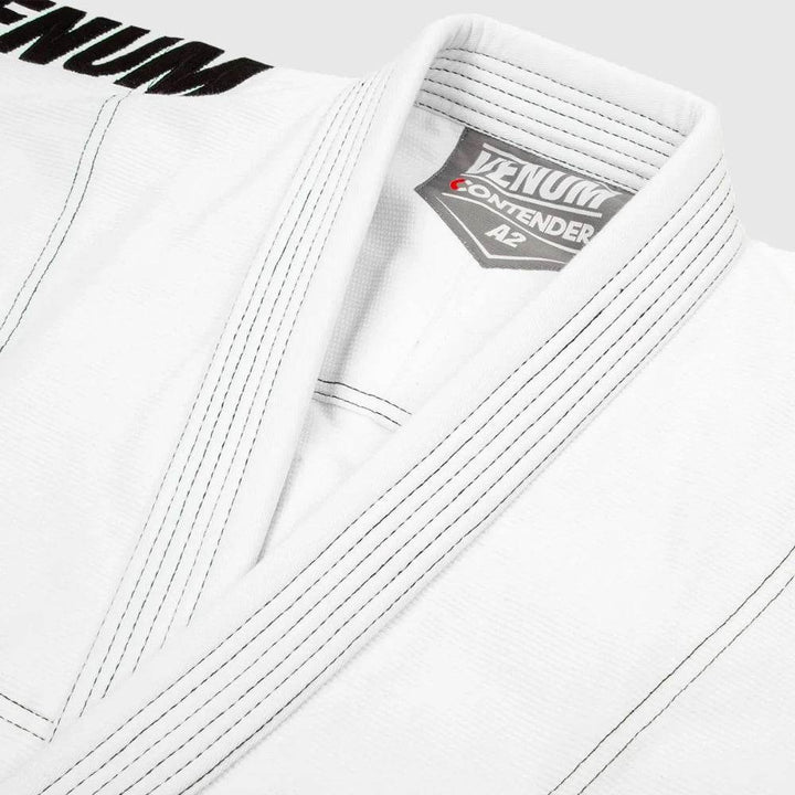 Zoomed-in on the lapel area showing fine weave stitching and Venum branding tag.