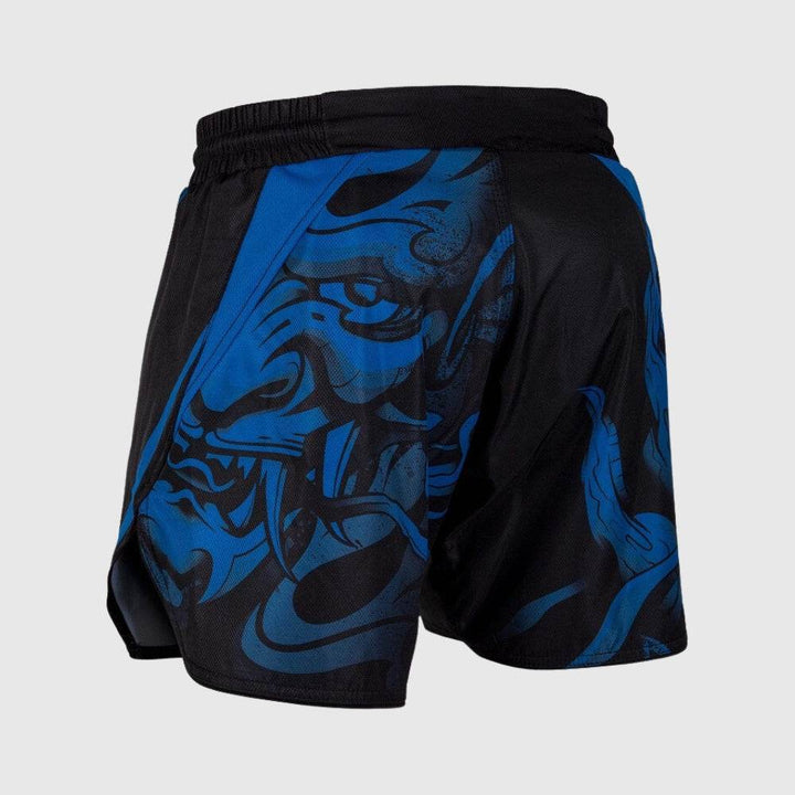 Rear left angle of black fight shorts showing large blue demonic face graphic wrapping around the hip, continuing the aggressive Oni design.