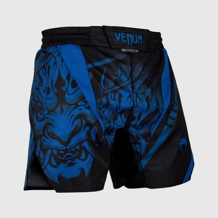 Frontal view showing full-width blue Oni mask artwork in high detail, with “VENUM” written on the waistband tab above a subtle “Fight Team” label.