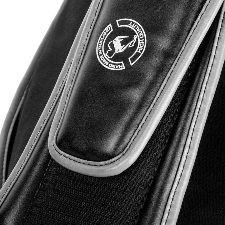 Close-up of the black waist strap with "Hand Made in Thailand" quality stamp on the Venum Elite Belly Protector.