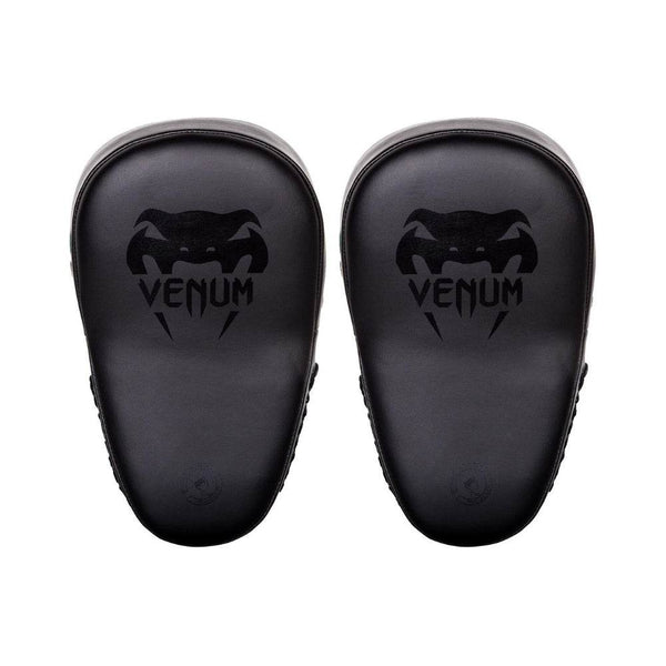 A pair of black Venum focus mitts, showing the front striking surface with the black Venum logo printed prominently.