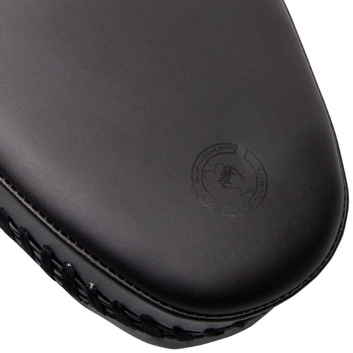 Zoomed-in detail of the lower front panel with a debossed "Made in Thailand" emblem near the edge.