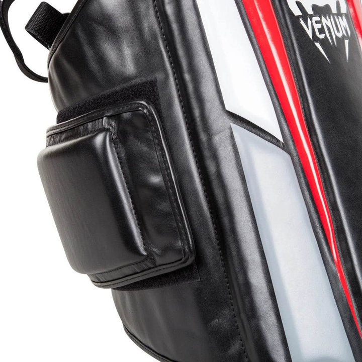 Detailed view of the side padding and velcro strap system on the Venum Elite Body Protector for enhanced shock absorption.