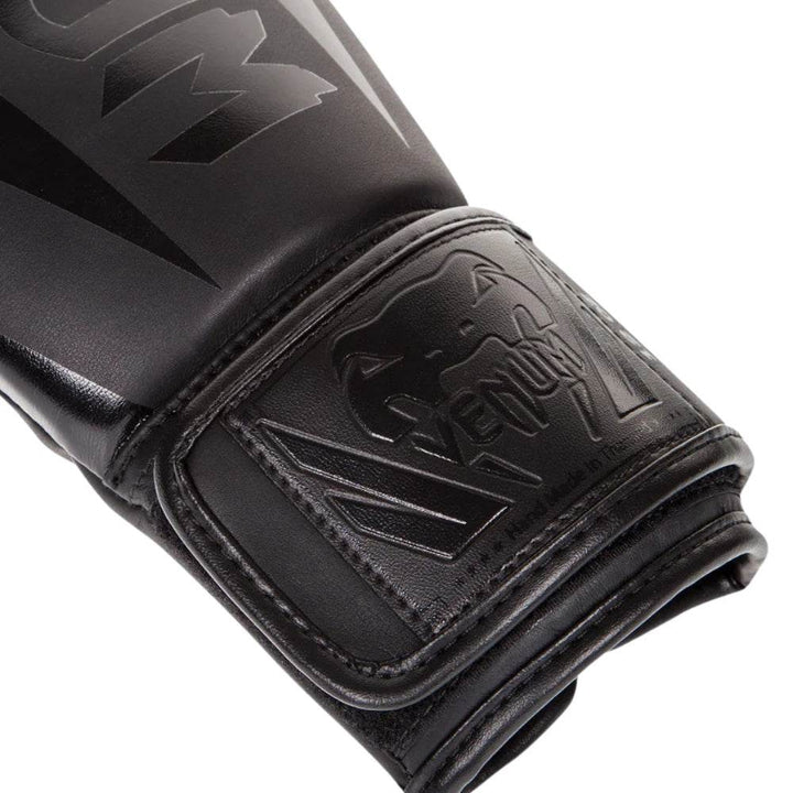 Close-up of embossed wrist patch with tonal black Venum logo.