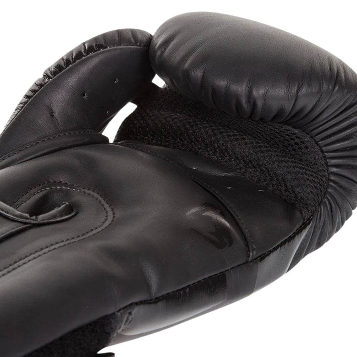 Inner glove palm featuring breathable mesh and subtle embossed logo detail.