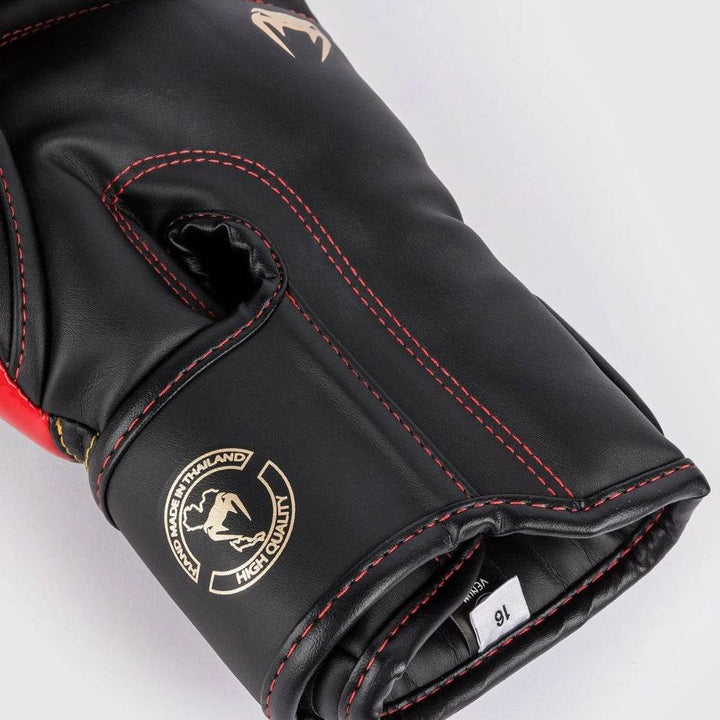 Detail of the palm area with red threading, high-quality craftsmanship badge, and open cuff label.