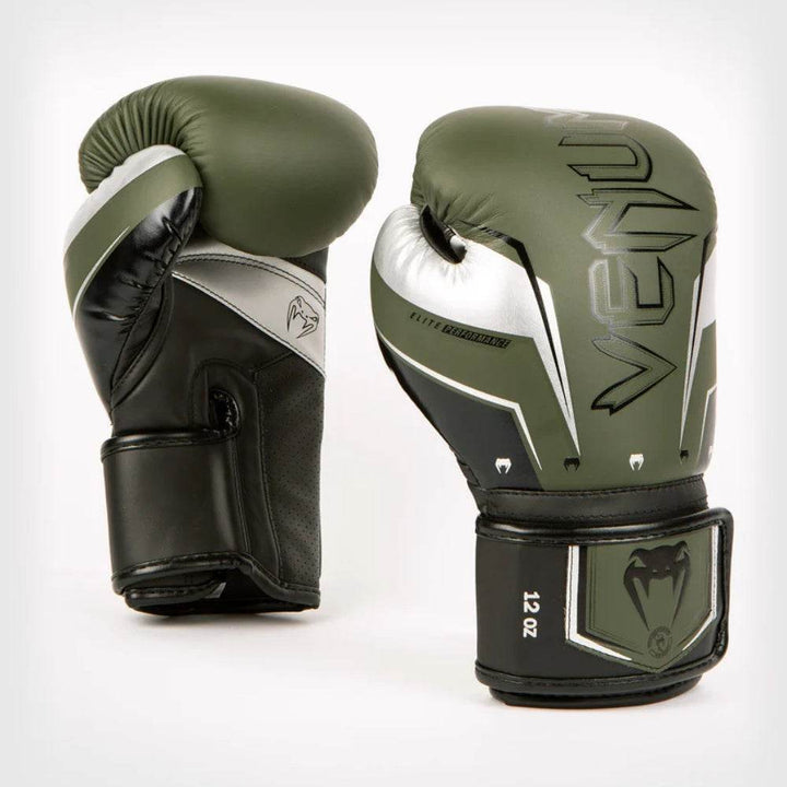 Front angled view of khaki-green Venum Elite Evo gloves with silver motifs.