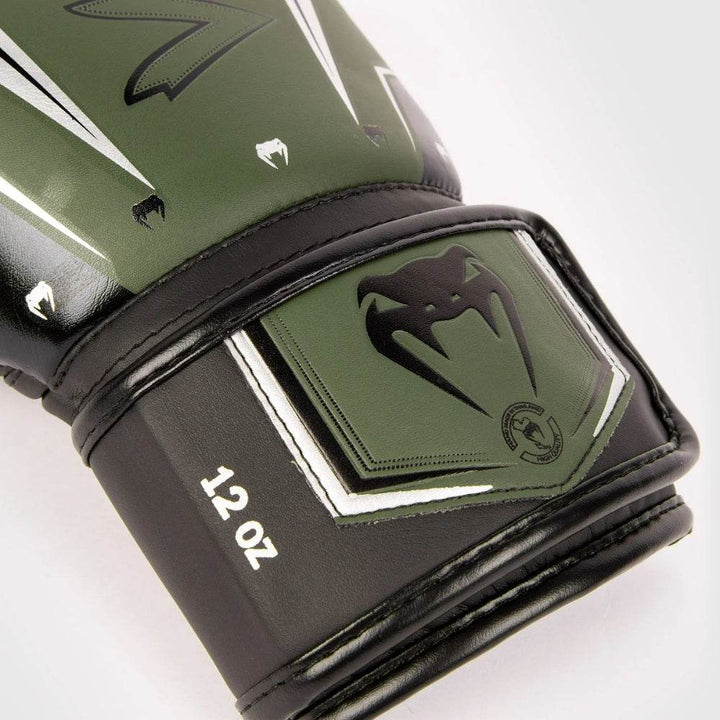 Macro of wrist badge – silver snake-head with “Hand Made in Thailand” text.