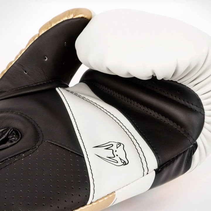 Palm-side close-up showing perforated mesh, lacing channel and white thumb.