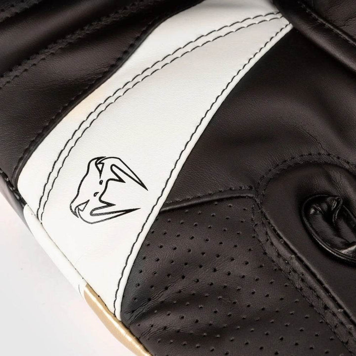 Outer palm design with black and white abstract design with black venum snakehead logo and highlighted black threading.