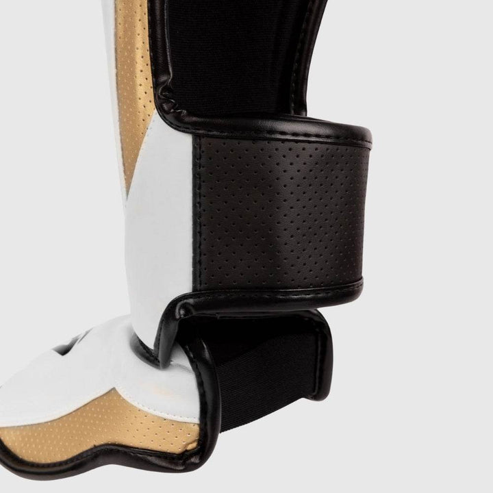 Rear view of the ankle and heel area on the Venum Elite Evo shinguards showing adjustable perforated black velcro straps.