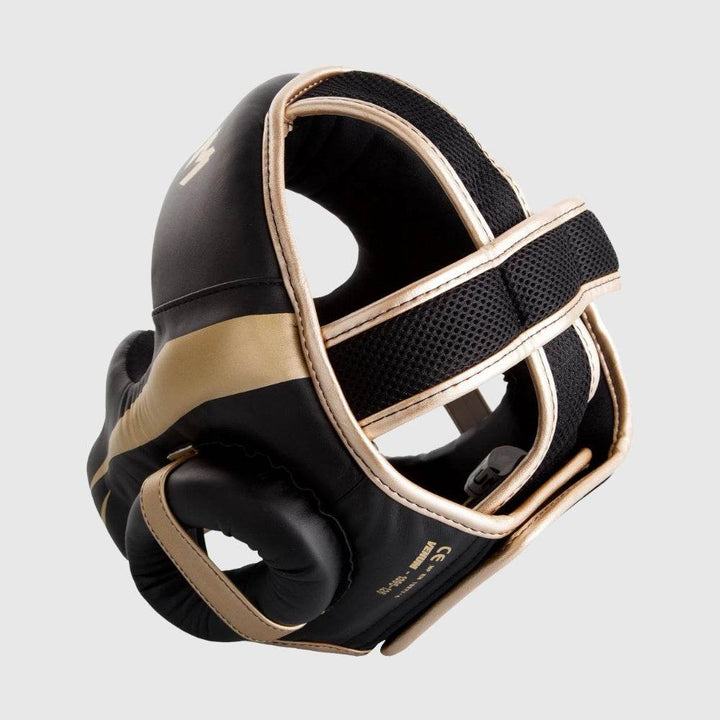 Back view of the headgear showing dual velcro straps and breathable black mesh for improved ventilation and secure fit, trimmed with gold piping.