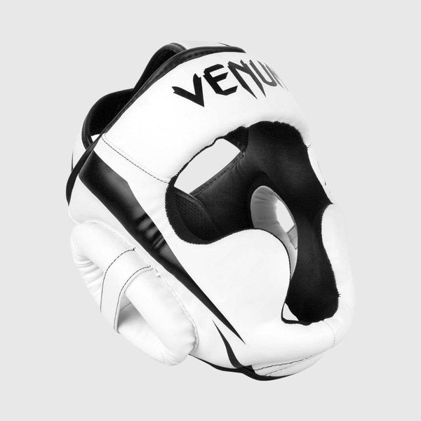 Angled front view of white Venum Elite headgear with black face contour and prominent eye opening.