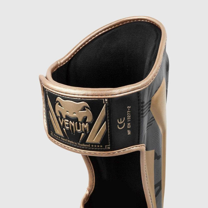 Close-up of the rear hook-and-loop closure strap, showing the Venum patch label "Hand Made in Thailand" with a black and gold finish.