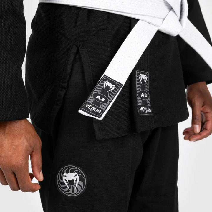 Detail shot of the gi hem, pants, and belt knot, featuring “A3” Venum size tags and leg patch embroidery.