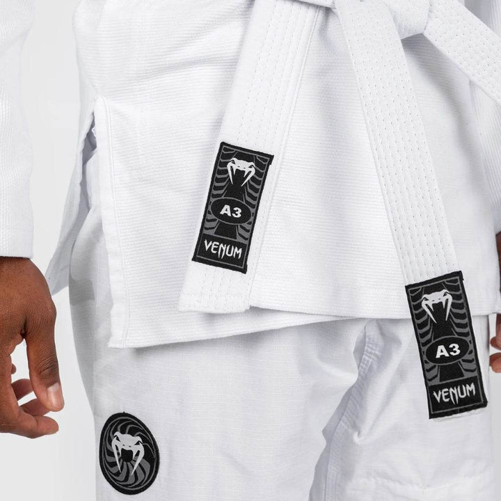Detailed shot of the belt and upper pant leg, highlighting the “A3” size label and the embroidered Venum snakehead logo patch.