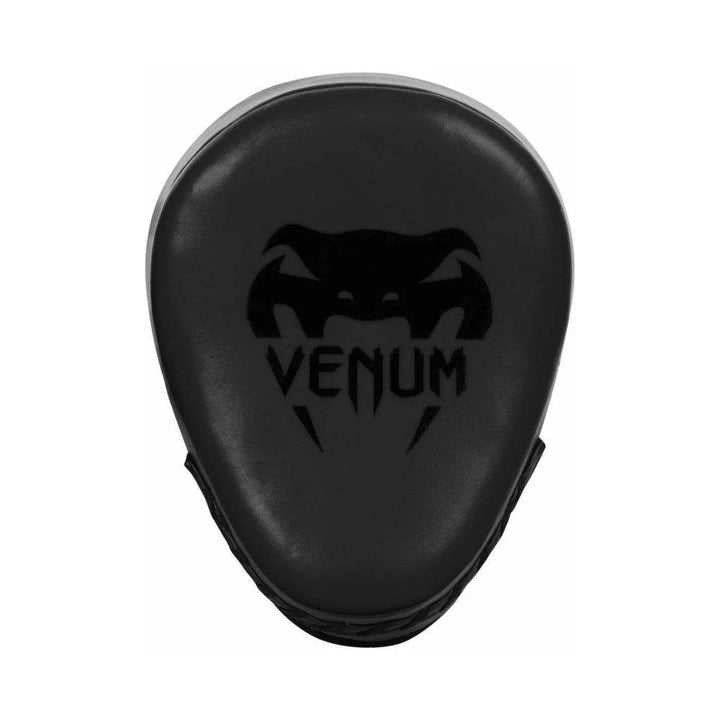 Front view of a single Venum black focus mitt, showcasing the sleek teardrop-shaped striking pad with embossed Venum logo.
