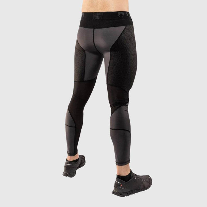 Rear angled view highlighting the mesh and smooth fabric contrast on the back of the legs.