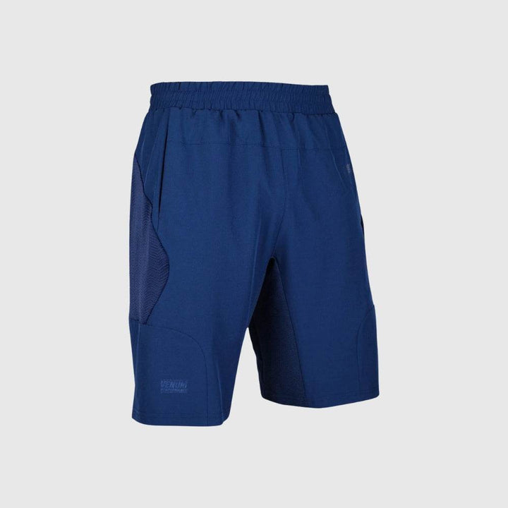 Front display of navy blue Venum training shorts with subtle logo detailing and smooth performance fabric.