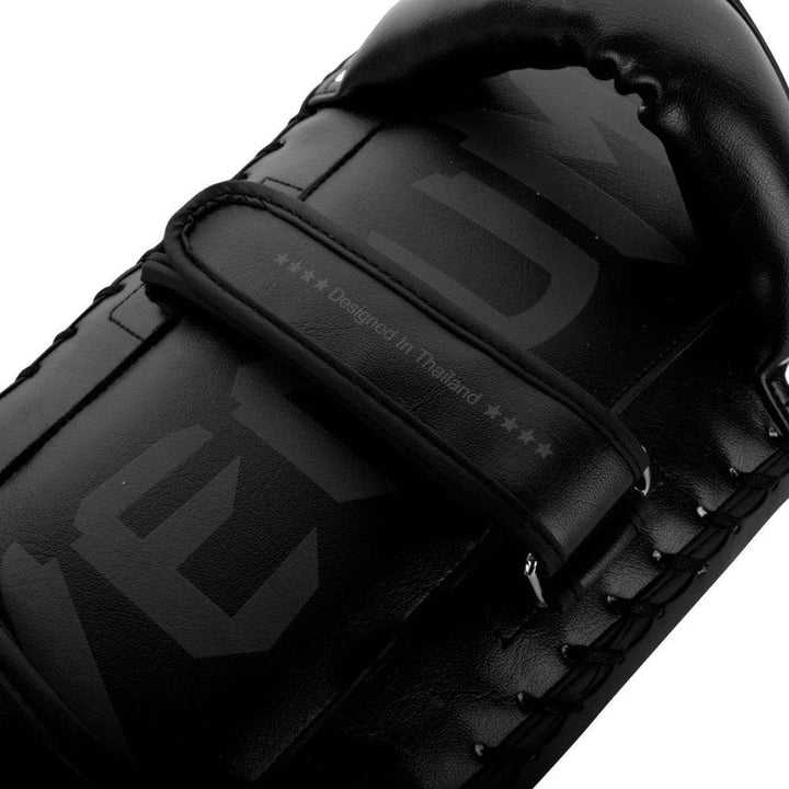 Close-up of the rear hand-strap section of the Venum Thai pad displaying the "Designed in Thailand" text and reinforced padding.