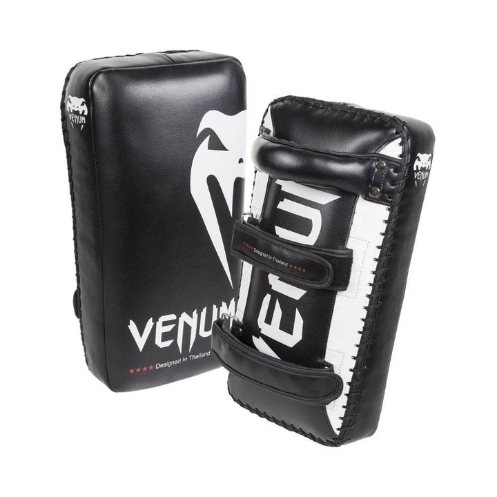 Front and back view of Venum Giant Kick Pads displaying the padded striking surface and dual-strap grip system with reinforced stitching.