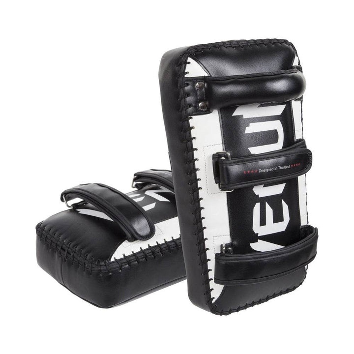 Venum Giant Kick Pads arranged to show rear side with secure handle and dual adjustable straps for enhanced trainer control.