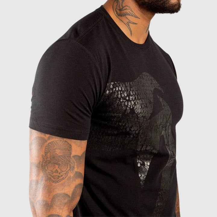 Close-up of the chest area showing the glossy snake texture and detailing on the t-shirt’s front.