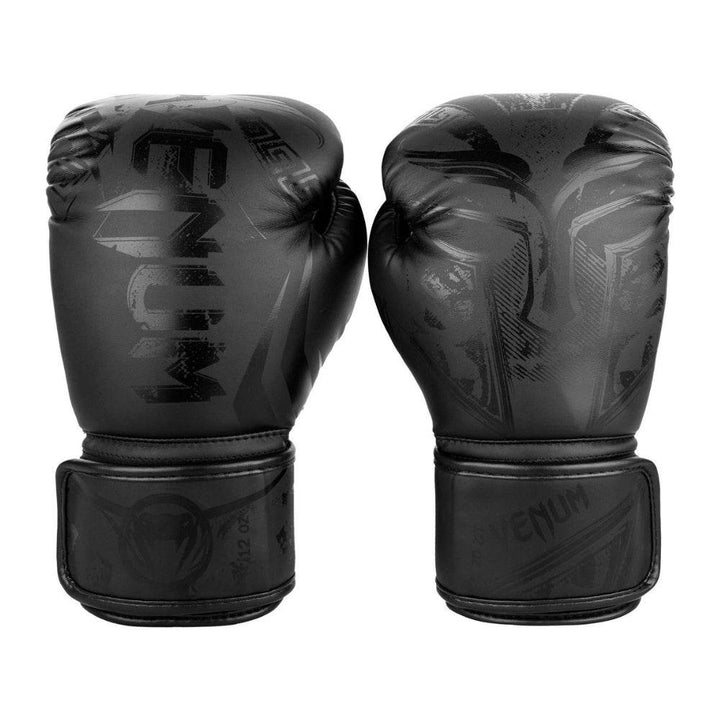 Pair of Gladiator 3.0 gloves displayed knuckle-forward, highlighting large black-on-black “VENUM” wordmark on left glove.