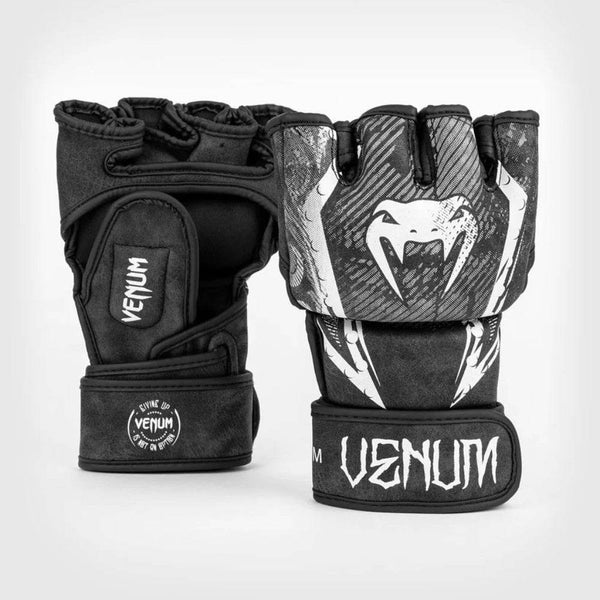 Venum Gladiator 4.0 MMA gloves shown front-facing with gladiator-themed white artwork on the knuckles and a stylized Venum logo on the wrist strap.