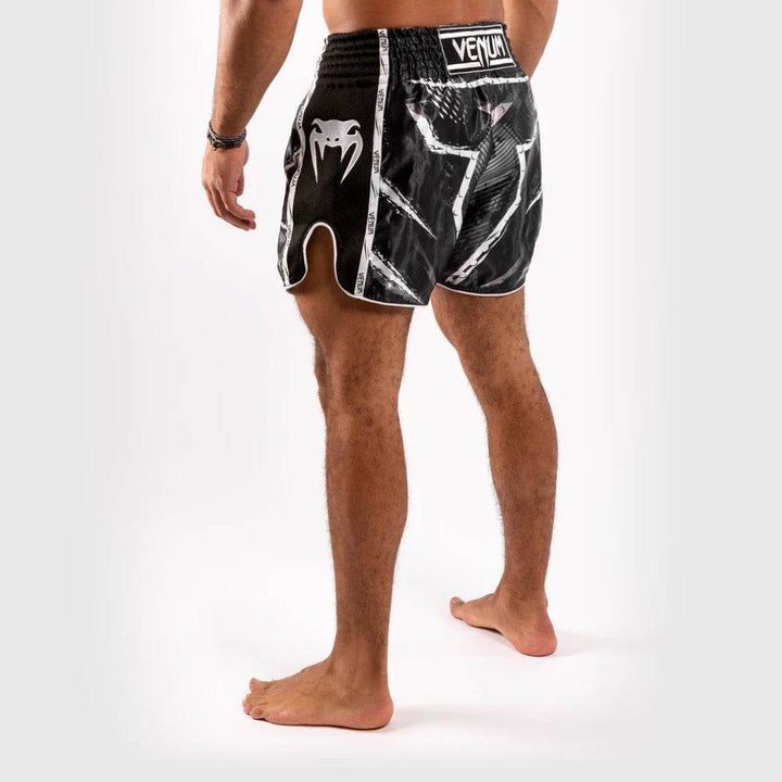 Rear-side angled view with white snake logo and intricate artwork.
