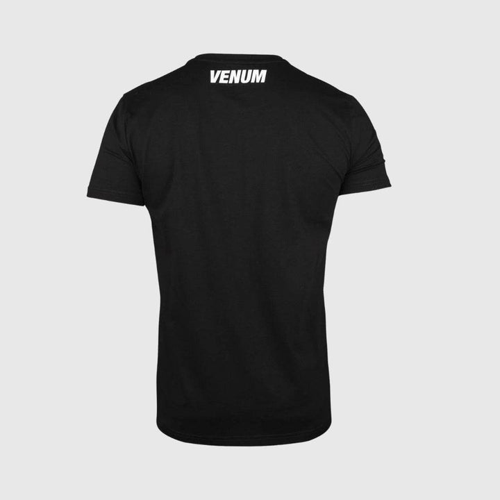 Rear view of a black Venum MMA t-shirt featuring a clean design with the “VENUM” logo printed in white at the top center near the neck.