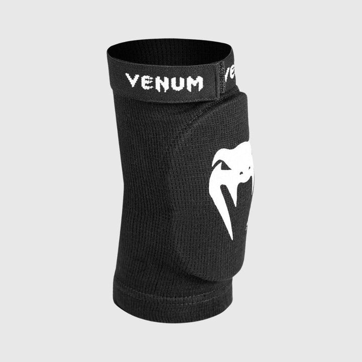 Side view of the Venum elbow pad showing the molded padding and ergonomic shape designed for joint protection and comfort.