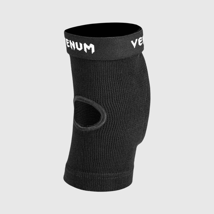 Rear view of the elbow protector featuring a fabric cut-out at the elbow joint to enhance flexibility and breathability.