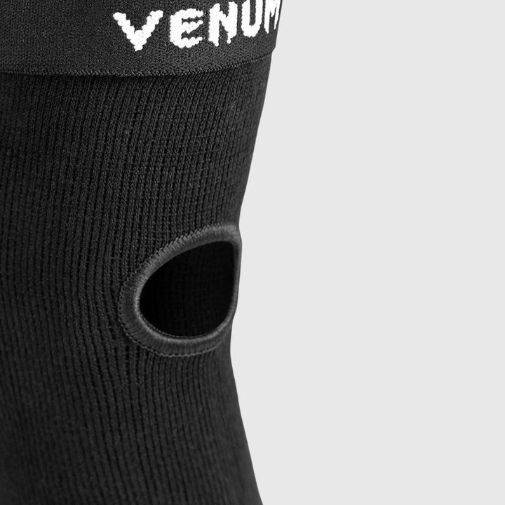 Detailed shot of the back cut-out in the elbow protector, showing the open-knit fabric design for ventilation and movement range.