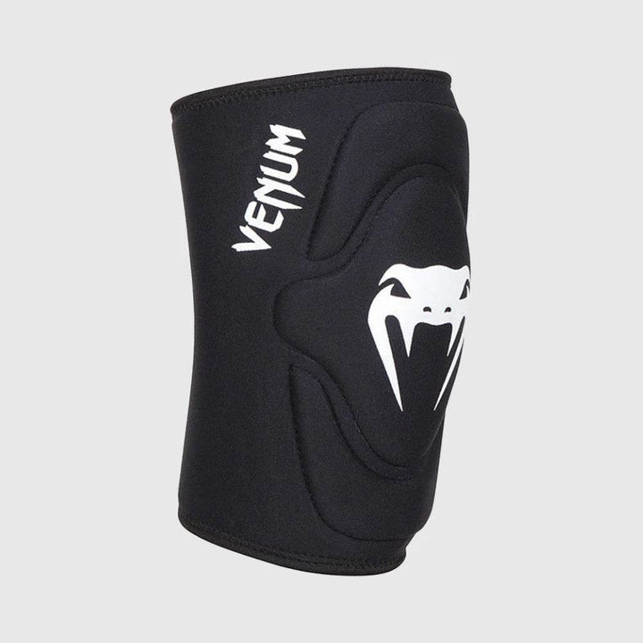 Black Venum knee pad with ergonomic padding and a prominent white Venum snakehead logo, displayed from a front-angle view.