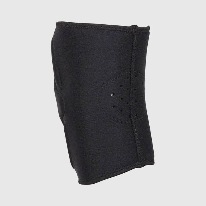 Side view of the Venum knee pad displaying its smooth black surface and laser-cut ventilation holes for breathability.