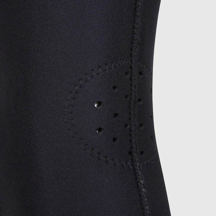 Zoomed-in view of the circular perforated ventilation holes on the side of the Venum knee pad for airflow and moisture control.