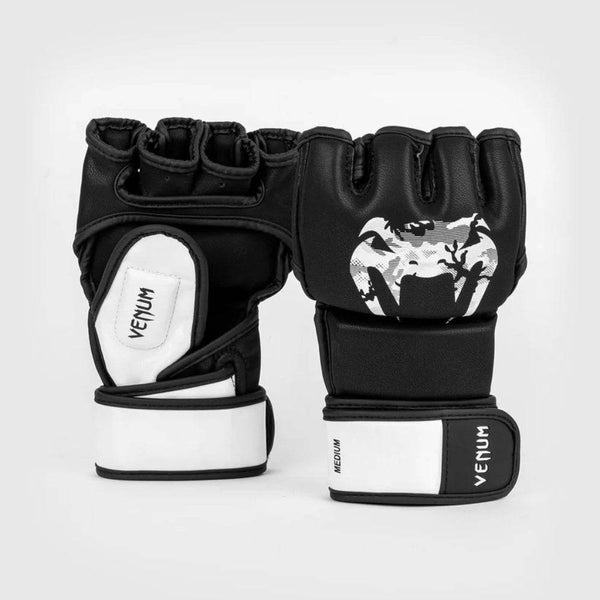Pair of black Venum Legacy MMA gloves with open-palm design, shown front and back. Features a white camo snakehead logo on the knuckles and white accent padding on the palm and wrist wrap.