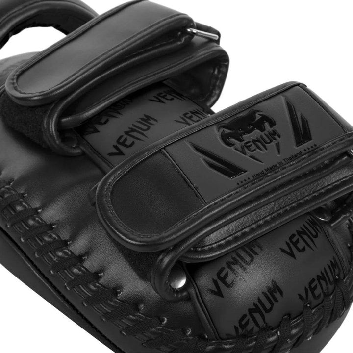 Close-up detail of the rear side of the Venum Elite mini mitt, showcasing dual Velcro straps, embossed Venum branding, and high-quality stitching for durability.