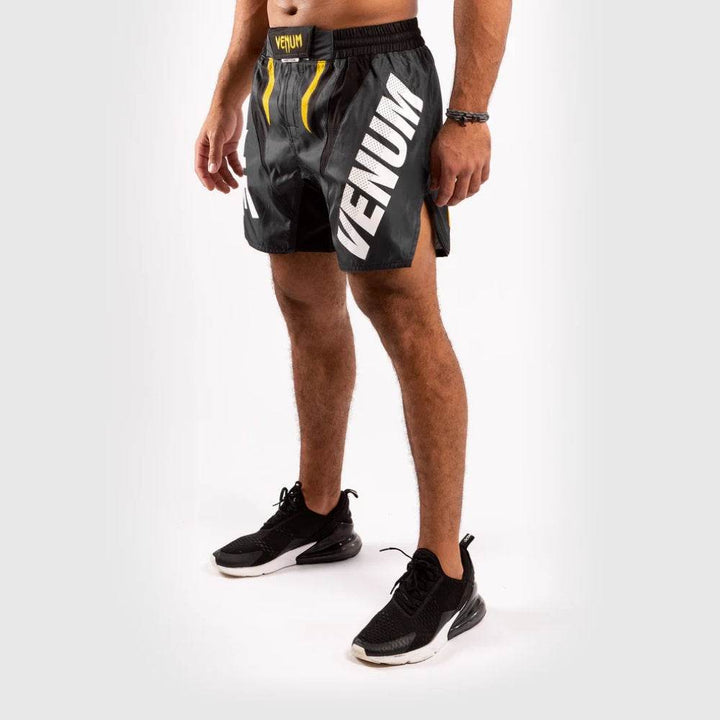 Clear view of the "VENUM" vertical logo on the left leg and mesh panel near the thigh.