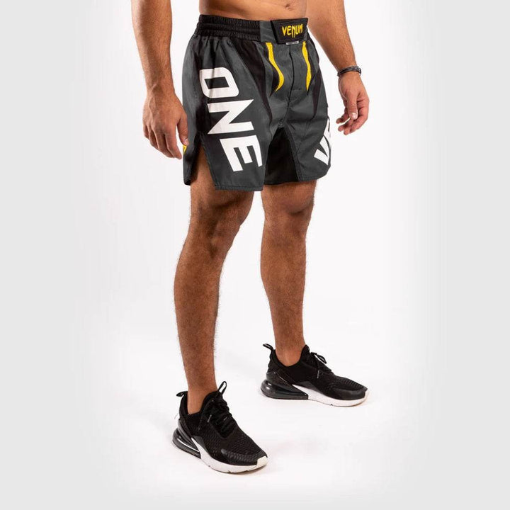 Prominent “ONE” logo on the right leg, with visible black and yellow contrast design elements.