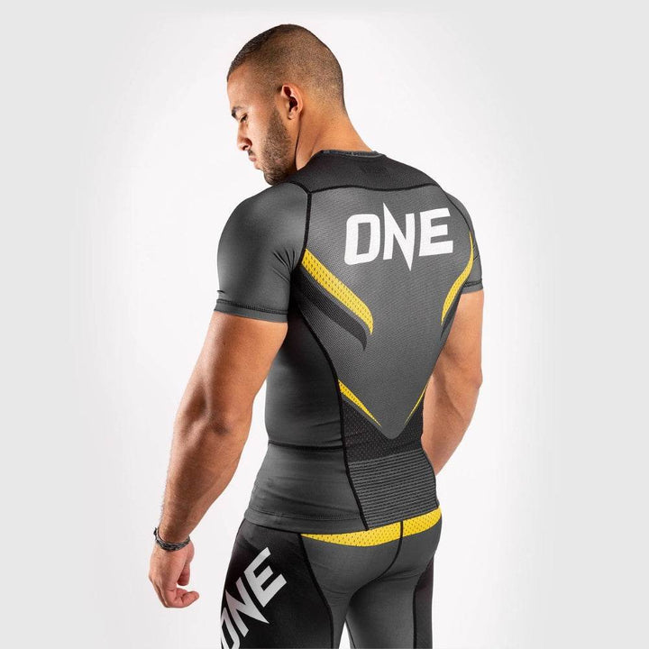 Back and side view of Venum rash guard with "ONE" branding and ventilated mesh panels.