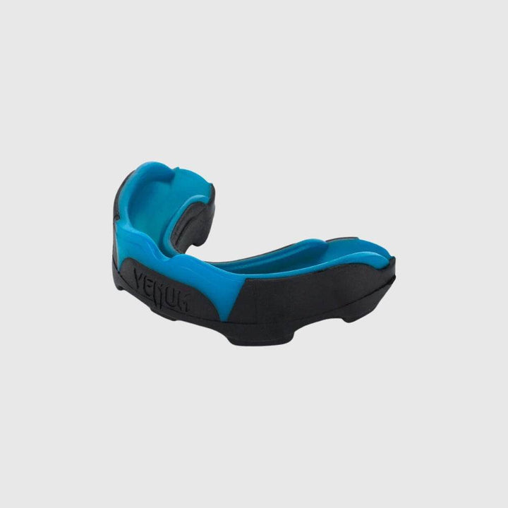 Side angle of the Venum Predator mouthguard in blue and black, displaying its ergonomic curvature and layered construction.